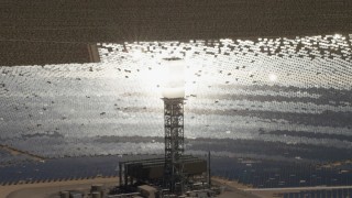 FG0001_000204 - 4K aerial stock footage zoom tighter to a clope-up of a power tower boiler at the Ivanpah Solar Electric Generating System in California