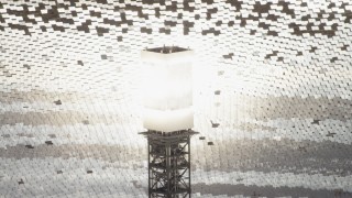 FG0001_000205 - 4K stock footage aerial video of glowing power tower boiler at the Ivanpah Solar Electric Generating System in California