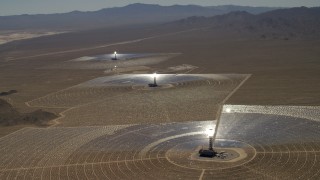 FG0001_000210 - 4K aerial stock footage of a view of the three solar power structures at the Ivanpah Solar Electric Generating System in California