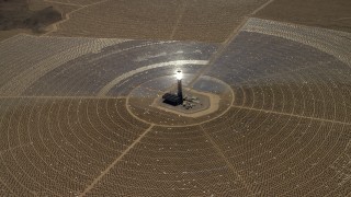 FG0001_000213 - 4K stock footage aerial video tilt to reveal and approach one of the solar power structures at the Ivanpah Solar Electric Generating System in California