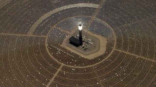 FG0001_000214 - 4K stock footage aerial video tilt to bird's eye of one of the solar power structures at the Ivanpah Solar Electric Generating System in California