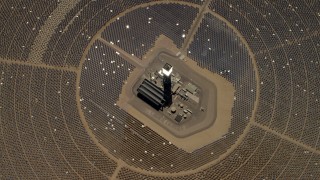 FG0001_000215 - 4K aerial stock footage of a bird's eye of one of the solar power structures at the Ivanpah Solar Electric Generating System in California