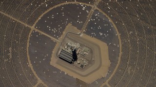 FG0001_000218 - 4K aerial stock footage of a bird's eye view of one of the mirror arrays and power towers at the Ivanpah Solar Electric Generating System in California