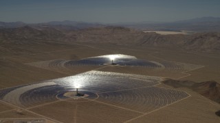 FG0001_000221 - 4K aerial stock footage of two of the mirror arrays and power towers at the Ivanpah Solar Electric Generating System in California