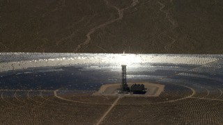FG0001_000223 - 4K aerial stock footage zoom to a mirror array and power tower at the Ivanpah Solar Electric Generating System in California