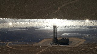 FG0001_000224 - 4K aerial stock footage of a mirror array and power tower at the Ivanpah Solar Electric Generating System in California