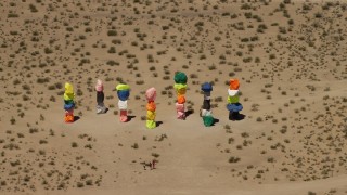 FG0001_000225 - 4K aerial stock footage of Seven Magic Mountains rock formation in the desert outside of Las Vegas, Nevada