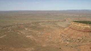 FG0001_000227 - 4K aerial stock footage approach a dry riverbed running through the Arizona Desert