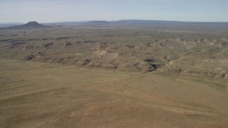 FG0001_000233 - 4K aerial stock footage of low mesas on a desert plain in the Arizona Desert