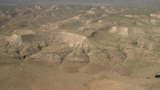 FG0001_000234 - 4K aerial stock footage of approaching arid mesas in the Arizona Desert
