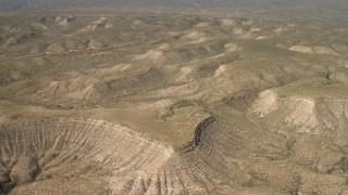 FG0001_000235 - 4K aerial stock footage fly over arid mesas in the Arizona Desert