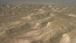 FG0001_000236 - 4K aerial stock footage fly above arid mesas in the Arizona Desert