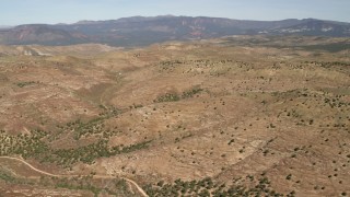 FG0001_000240 - 4K aerial stock footage of passing mountains in the Arizona Desert