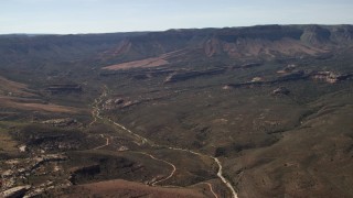 FG0001_000242 - 4K aerial stock footage of mesas and small buttes in the Arizona Desert
