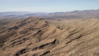 FG0001_000250 - 4K aerial stock footage flyby mountains to reveal a wide canyon in the Arizona Desert
