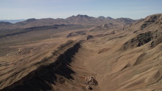 FG0001_000254 - 4K stock footage aerial video of a view across rough desert mountains in the Nevada Desert