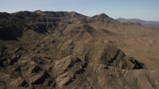FG0001_000257 - 4K aerial stock footage flyby a rocky mountain ridge in the Nevada Desert