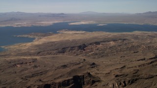 FG0001_000280 - 4K aerial stock footage of Lake Mead seen from the rugged desert in Nevada