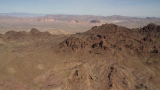 FG0001_000283 - 4K aerial stock footage of rugged, barren mountains in the Nevada Desert