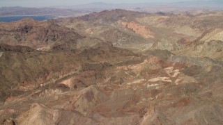 FG0001_000285 - 4K aerial stock footage fly over rugged, barren mountains near Lake Mead in the Nevada Desert