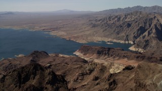 FG0001_000287 - 4K aerial stock footage flyby barren mountains on the shore of Lake Mead, Nevada