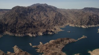 FG0001_000296 - 4K aerial stock footage of a view of tall desert mountains on the opposite shore of Lake Mead, Nevada
