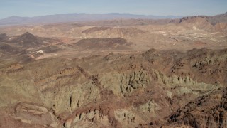 FG0001_000297 - 4K aerial stock footage of rough mountains in a barren Nevada Desert landscape