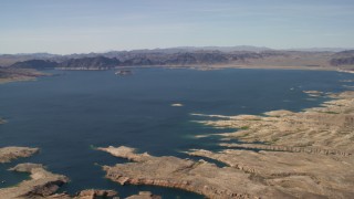 FG0001_000298 - 4K aerial stock footage of a view across Lake Mead ringed by Nevada desert