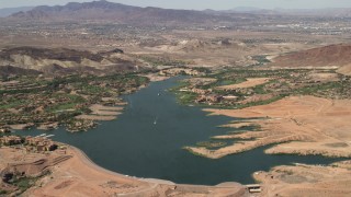 FG0001_000300 - 4K aerial stock footage of lakefront homes and Westin resort spa on Lake Las Vegas in Henderson, Nevada