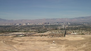 FG0001_000306 - 4K stock footage aerial video fly over a desert mountain to reveal the city of Las Vegas, Nevada