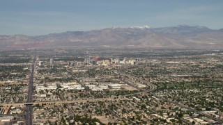 FG0001_000311 - 4K aerial stock footage of Downtown Las Vegas hotels and casinos seen from I-515 and suburban neighborhoods, Nevada