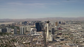 FG0001_000318 - 4K aerial stock footage flyby Stratosphere with a view of hotels and casinos on the Las Vegas Strip in Nevada