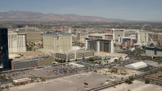 FG0001_000335 - 4K aerial stock footage pan across casino resorts on the Las Vegas Strip, Nevada, to focus on Planet Hollywood and Paris Las Vegas