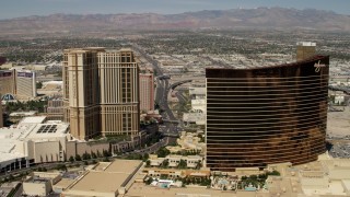 FG0001_000338 - 4K aerial stock footage flyby the the Palazzo to reveal the Wynn and Encore casino resorts on the Las Vegas Strip, Nevada