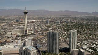 FG0001_000339 - 4K aerial stock footage approach Stratosphere with Downtown Las Vegas casinos in the background, Nevada