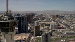 FG0001_000342 - 4K aerial stock footage flyby the top of Stratosphere Las Vegas, Nevada, and focus on casino resorts on the Las Vegas Strip