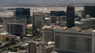 FG0001_000347 - 4K aerial stock footage of Paris Las Vegas and Bally's on the Las Vegas Strip, Nevada, seen from Caesar's Palace
