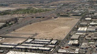 FG0001_000349 - 4K aerial stock footage of the future site of the Las Vegas Raiders stadium and the 15 freeway in Las Vegas, Nevada
