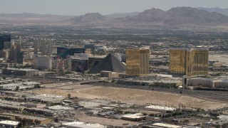 FG0001_000354 - 4K aerial stock footage of Las Vegas Strip casino resort hotels across I-15 from an open dirt lot in Las Vegas, Nevada