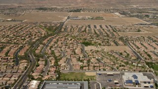 FG0001_000358 - 4K aerial stock footage fly over and pan across neighborhoods with tract homes and apartment buildings in Las Vegas, Nevada