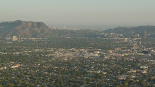 HDA06_01 - HD stock footage aerial video fly over North Hollywood toward Mount Lee and Downtown Los Angeles, California, sunset