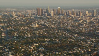 HDA06_13 - HD stock footage aerial video fly over Silver Lake neighborhoods to approach Downtown Los Angeles at sunset, California