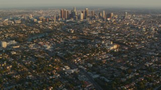 HDA06_15 - HD stock footage aerial video Downtown Los Angeles skyscrapers at sunset seen from Echo Lake in Echo Park, California