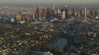 HDA06_16 - HD stock footage aerial video Downtown Los Angeles seen from Echo Lake at sunset, Echo Park, California
