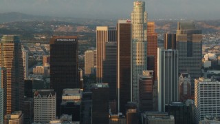 HDA06_26 - HD stock footage aerial video flyby the tall towers of Downtown Los Angeles, California at sunset