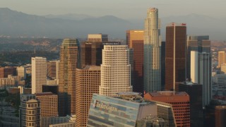 HDA06_27 - HD stock footage aerial video flying by the skyscrapers of Downtown Los Angeles at sunset, California