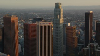 HDA06_30 - HD stock footage aerial video Bank of America Center and US Bank Tower at sunset in Downtown Los Angeles, California