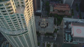 HDA06_33 - HD stock footage aerial video bird's eye view of S Hope Street and the Los Angeles Public Library at sunset, Downtown Los Angeles, California