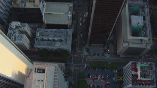 HDA06_34 - HD stock footage aerial video bird's eye view of S Hope Street through Downtown Los Angeles, California at sunset