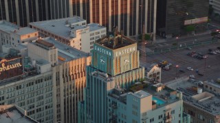 HDA06_49 - HD stock footage aerial video orbit the Eastern Columbia Building to reveal the Orpheum Theater at sunset, Downtown Los Angeles, California